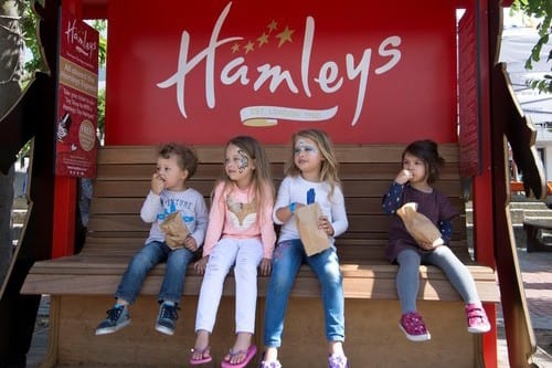 Children on bench waiting for a Wattman train