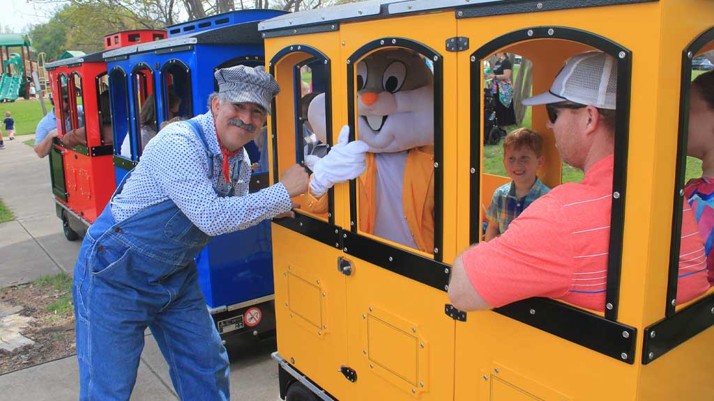 Trackless train operating in an amusement park, offering safe and fun rides for children and families