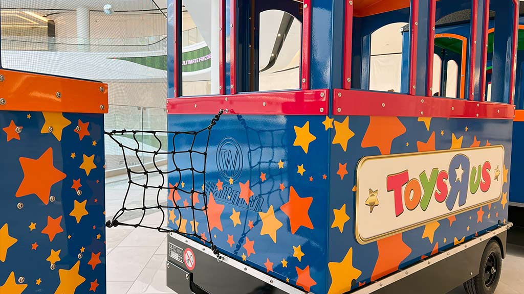 Customized Wattman attraction train in branded colours and logo design for premium visual identity