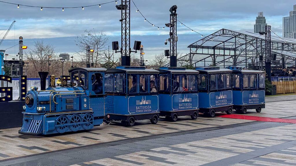 Electric Wattman Maxi Express trackless train at Battersea Power Station, London riverside